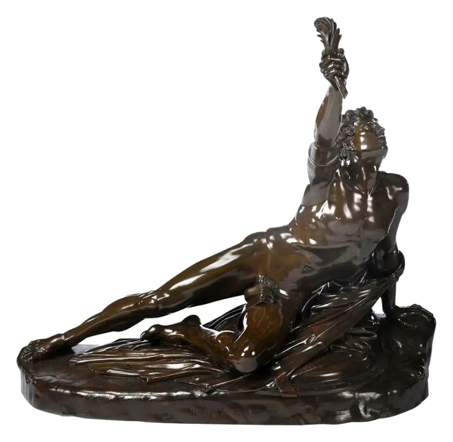 Bronze sculpture with a brown patina: a reclining figure raising a palm