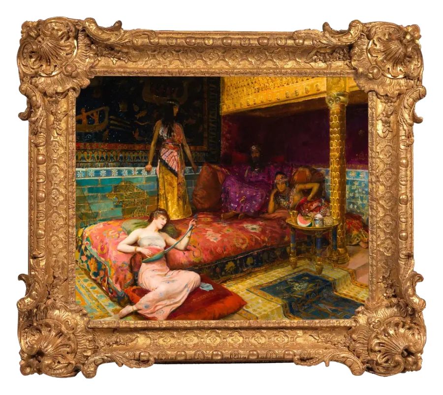 Orientalist painting in a carved gilt frame